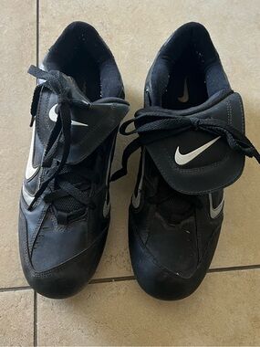 Nike Black baseball cleats with White Swoosh Accents